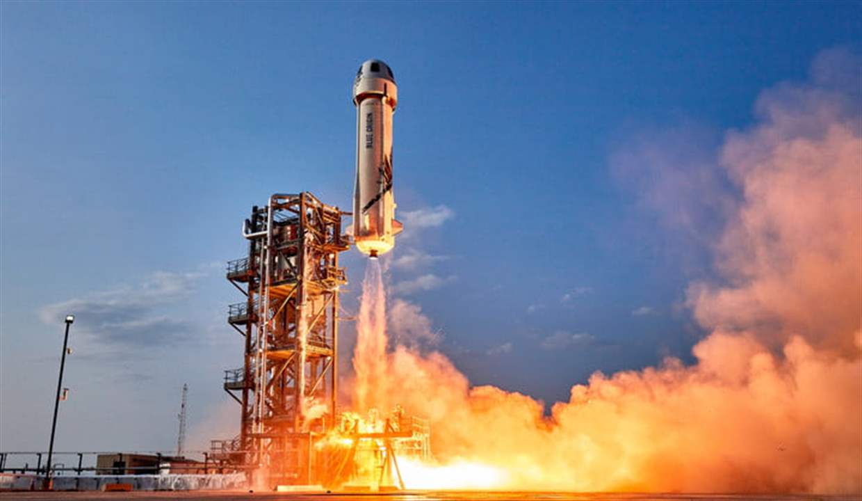 Why did Blue Origin postpone William Shatner's space flight by a day?