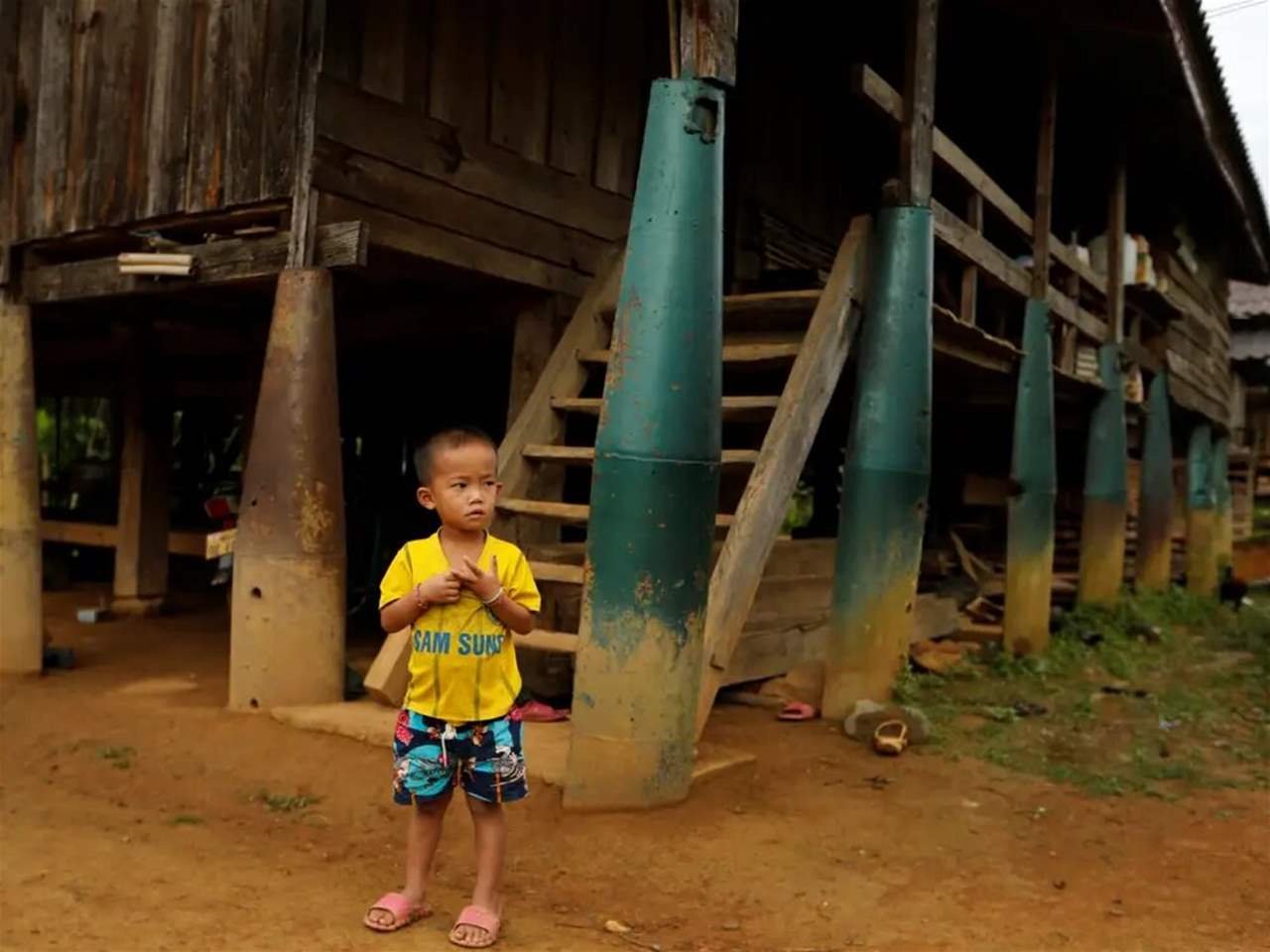 Inside the Laos villages where people build homes, canoes, and tools out of unexploded bombs left over from the Vietnam War