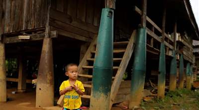 Inside the Laos villages where people build homes, canoes, and tools out of unexploded bombs left over from the Vietnam War