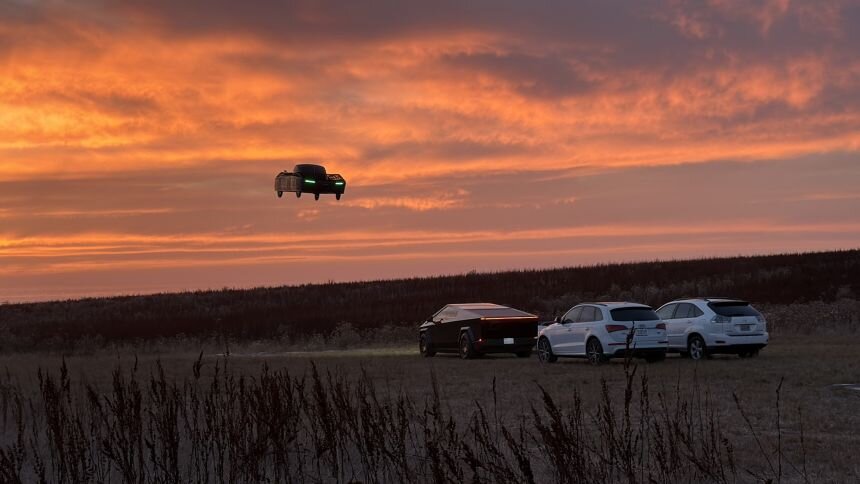 An Alef vehicle flies over cars including a Tesla Roadster and a Cybertruck.